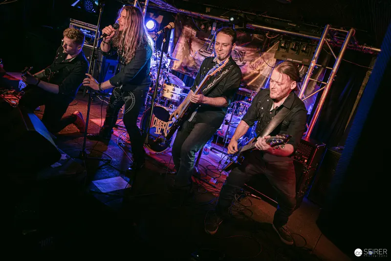 Erin and Band Performing Intense Rock Set at Replugged Vienna