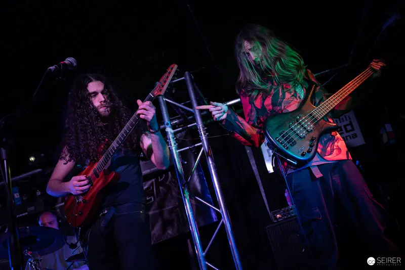 Extreme Mind Guitarists Performing Intense Rock Set at Replugged