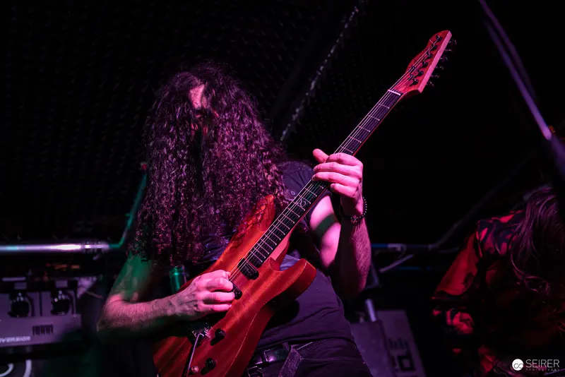 Extreme Mind's Guitarist in Intense Performance at Replugged Concert