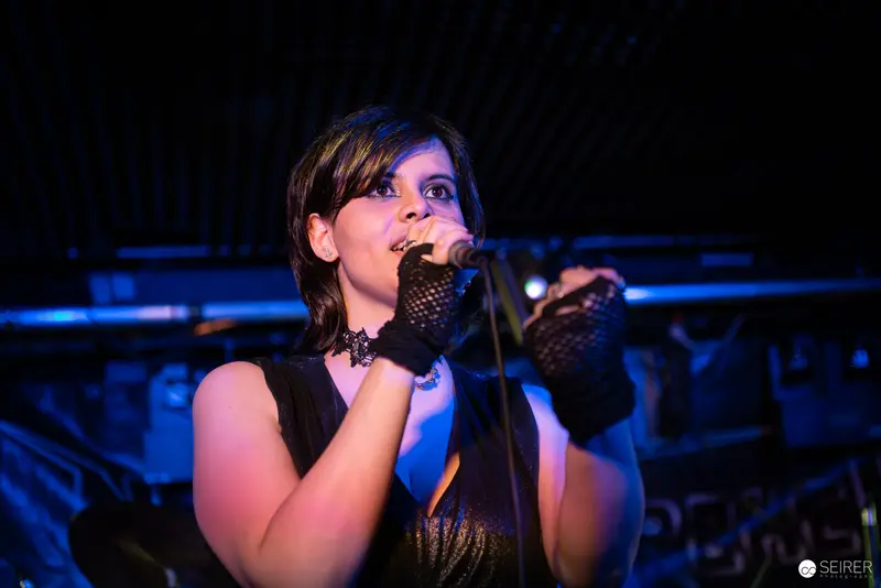 Extreme Mind Vocalist Performing in Mesh Gloves at Replugged Concert
