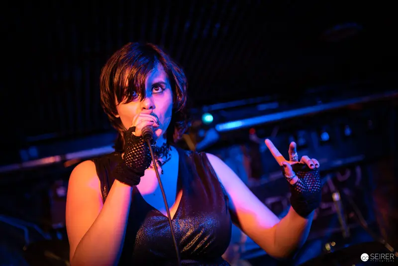 Extreme Mind Vocalist Performing with Intense Energy at Replugged Concert