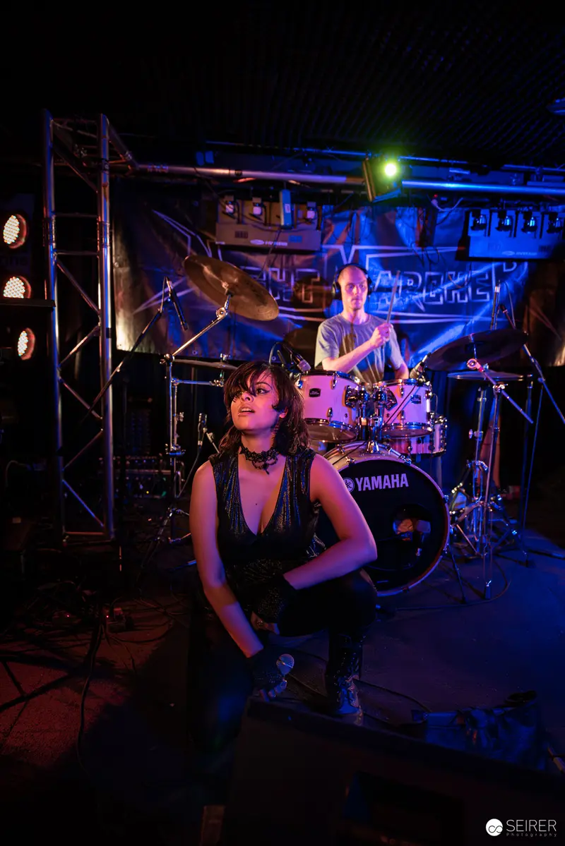 Extreme Mind's Intense Performance at Replugged, Dramatic Stage Lighting