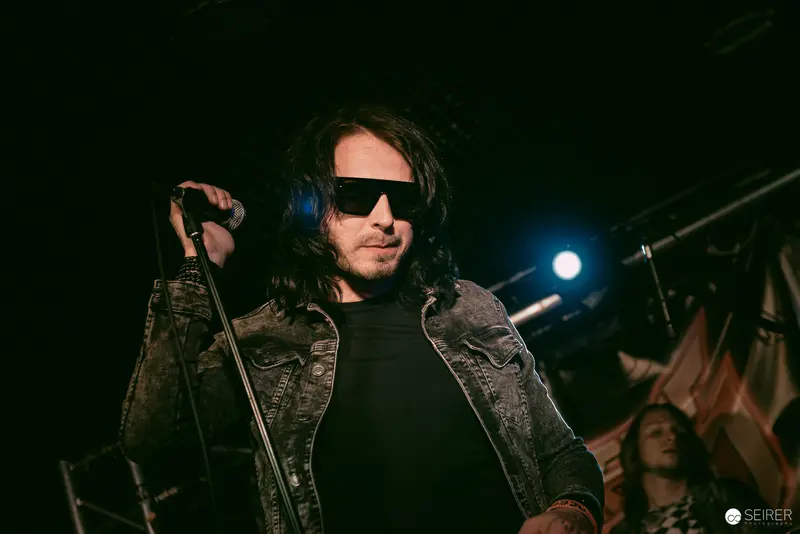 Lead Singer in Denim Jacket Performs at Replugged, Vienna