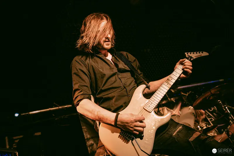 Electric Guitarist Performing Intense Solo at Replugged, Vienna