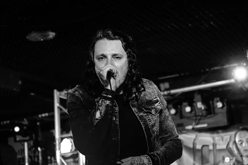 Lead Singer of Jokers IV Performing Intensely at Replugged, Vienna