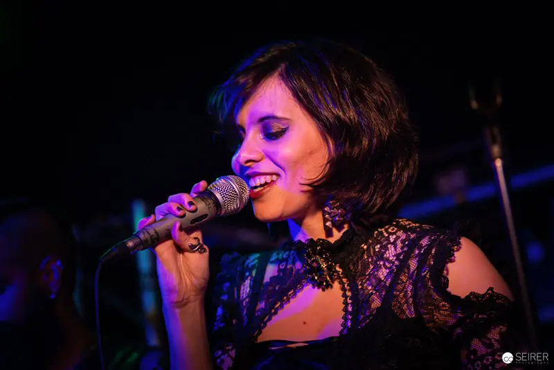 Nightmarcher Performing Passionate Vocal Set at Replugged Vienna with Dramatic Lighting