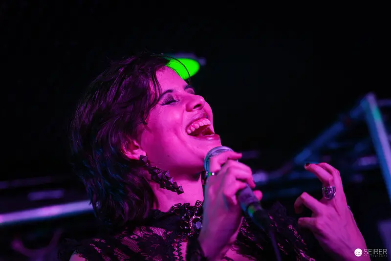 Nightmarcher Performing Passionately at Replugged Vienna with Vibrant Stage Lighting
