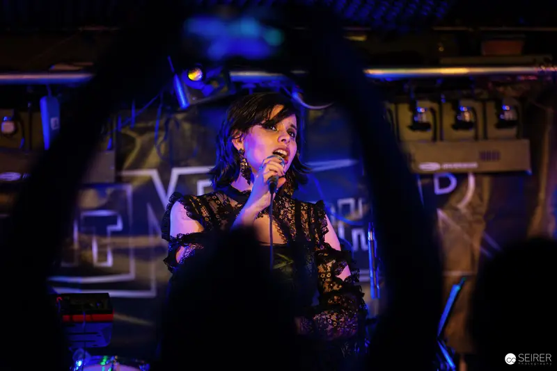 Nightmarcher Performing in Dramatic Blue Lighting at Replugged Vienna