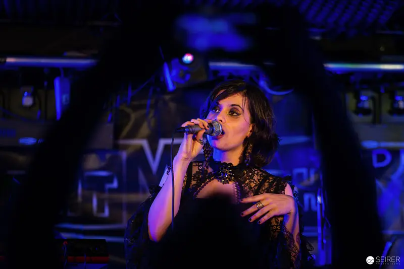 Nightmarcher's Intense Performance at Replugged Vienna in Blue Stage Light