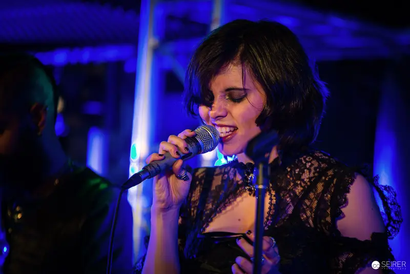 Nightmarcher Performing in Blue-Lit Intensity at Replugged Vienna