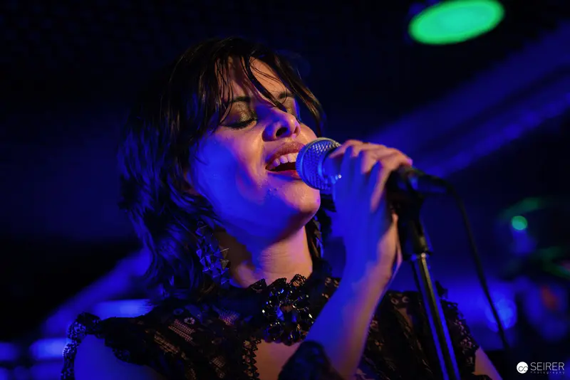 Nightmarcher Performing Intense Vocal Set at Replugged Vienna with Dramatic Blue Lighting