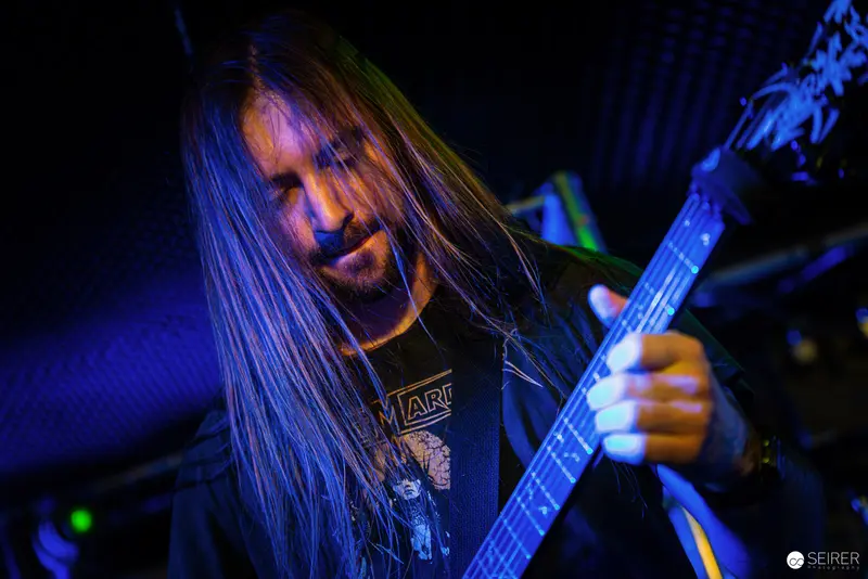 Nightmarcher Guitarist in Intense Blue Performance Lighting at Replugged Vienna