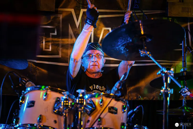 Nightmarcher Drummer Intensely Performing at Replugged Vienna Under Dramatic Lighting