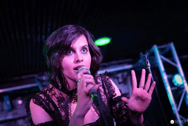 Nightmarcher Performing Intense Vocal Set at Replugged Vienna with Dramatic Gesture