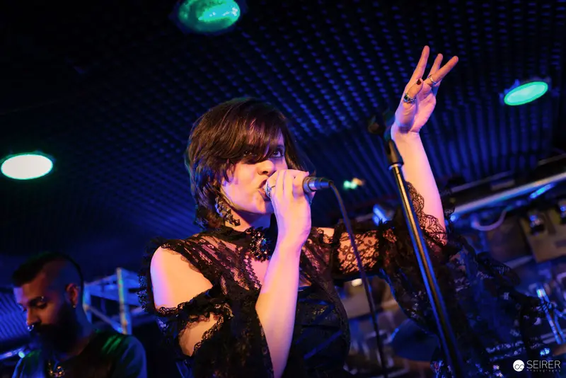 Nightmarcher Performing Energetic Set at Replugged Vienna with Dynamic Microphone Gesture