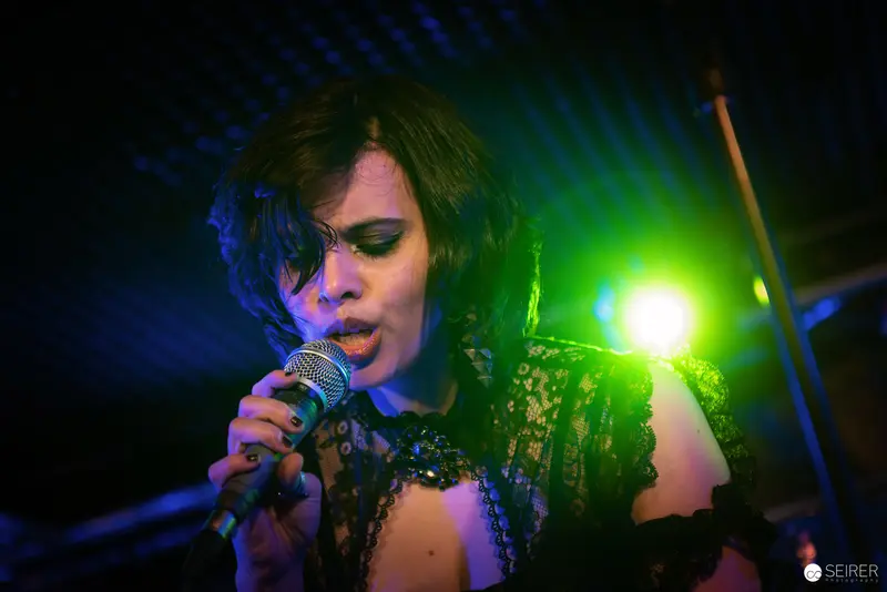 Nightmarcher Performing Intense Vocal Set at Replugged Vienna with Dramatic Lighting