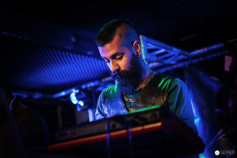 Nightmarcher Performing at Replugged Vienna Under Intense Blue Stage Lighting