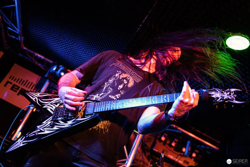 Nightmarcher Guitarist Performing Intense Metal Set at Replugged Vienna