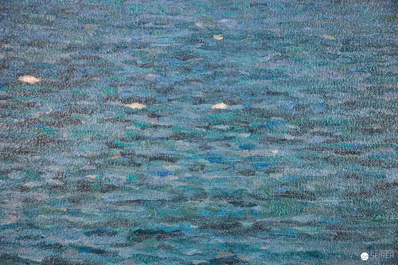 Textured Ocean Landscape in Muted Blue Tones with Luminous Highlights