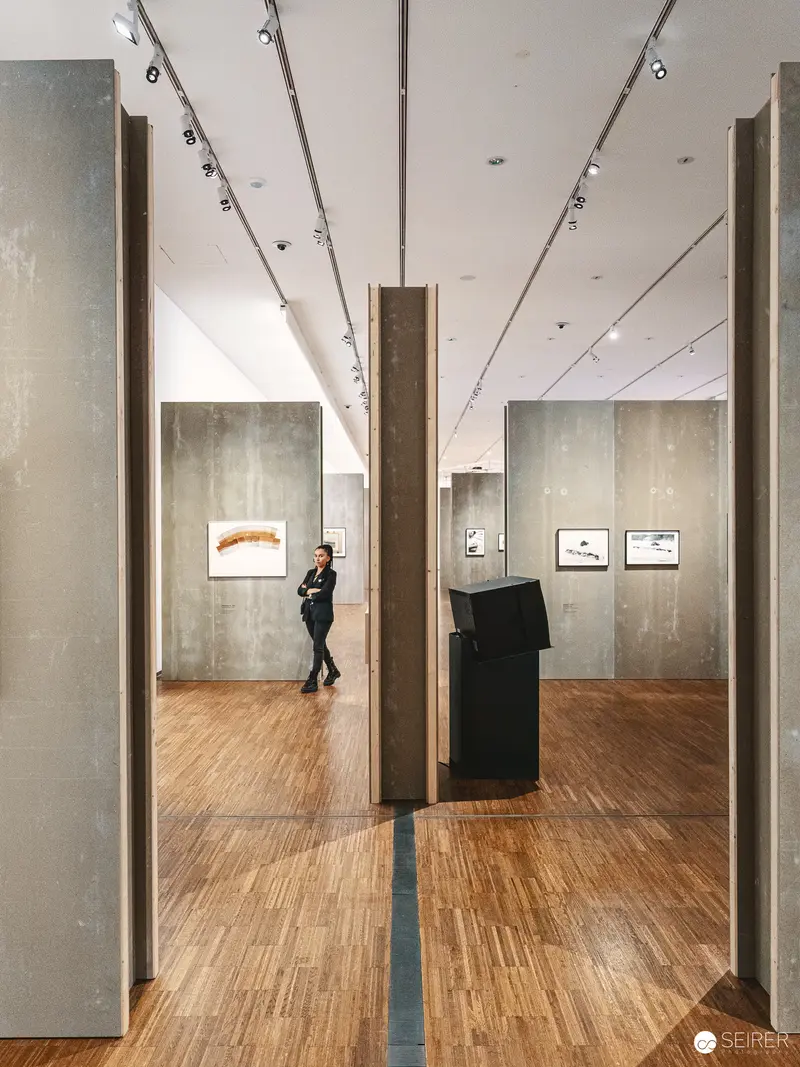 Contemplative Moment in Gallery Space: VALIE EXPORT Exhibition at Albertina