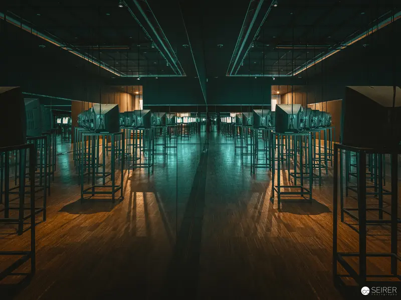 Symmetrical Interior with Reflective Surfaces and Geometric Metal Structures