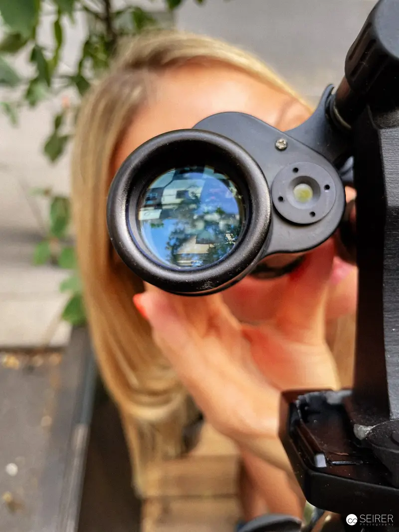 Optical Lens Reflects Earth Through Telescopic Viewfinder at Photography Session