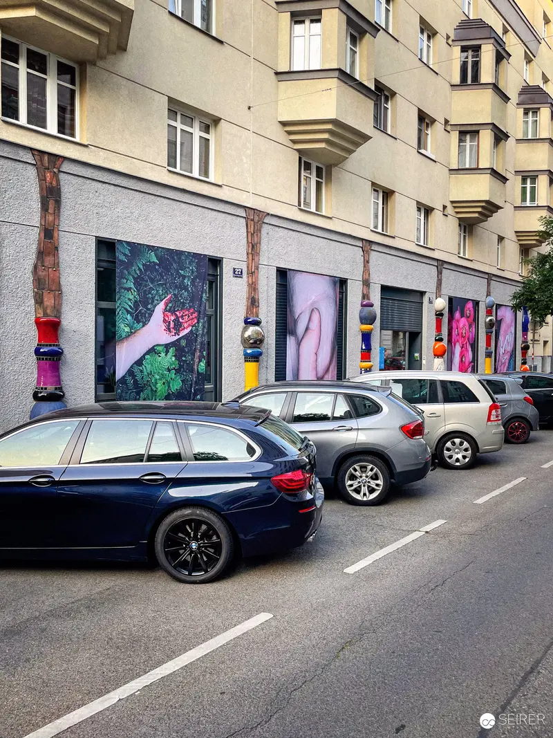 Street Art Window Display Along Urban Residential Block in Vienna