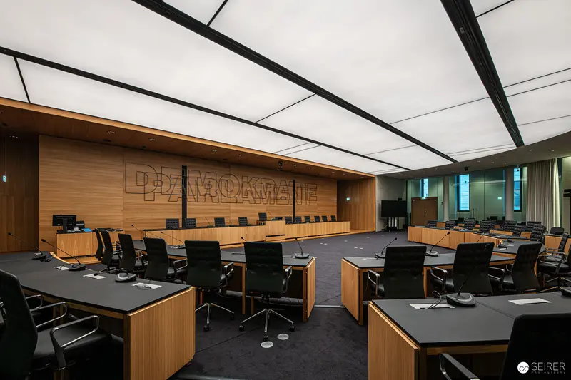 Interior of Renovated Austrian Parliament Chamber with Modern Wood Paneling