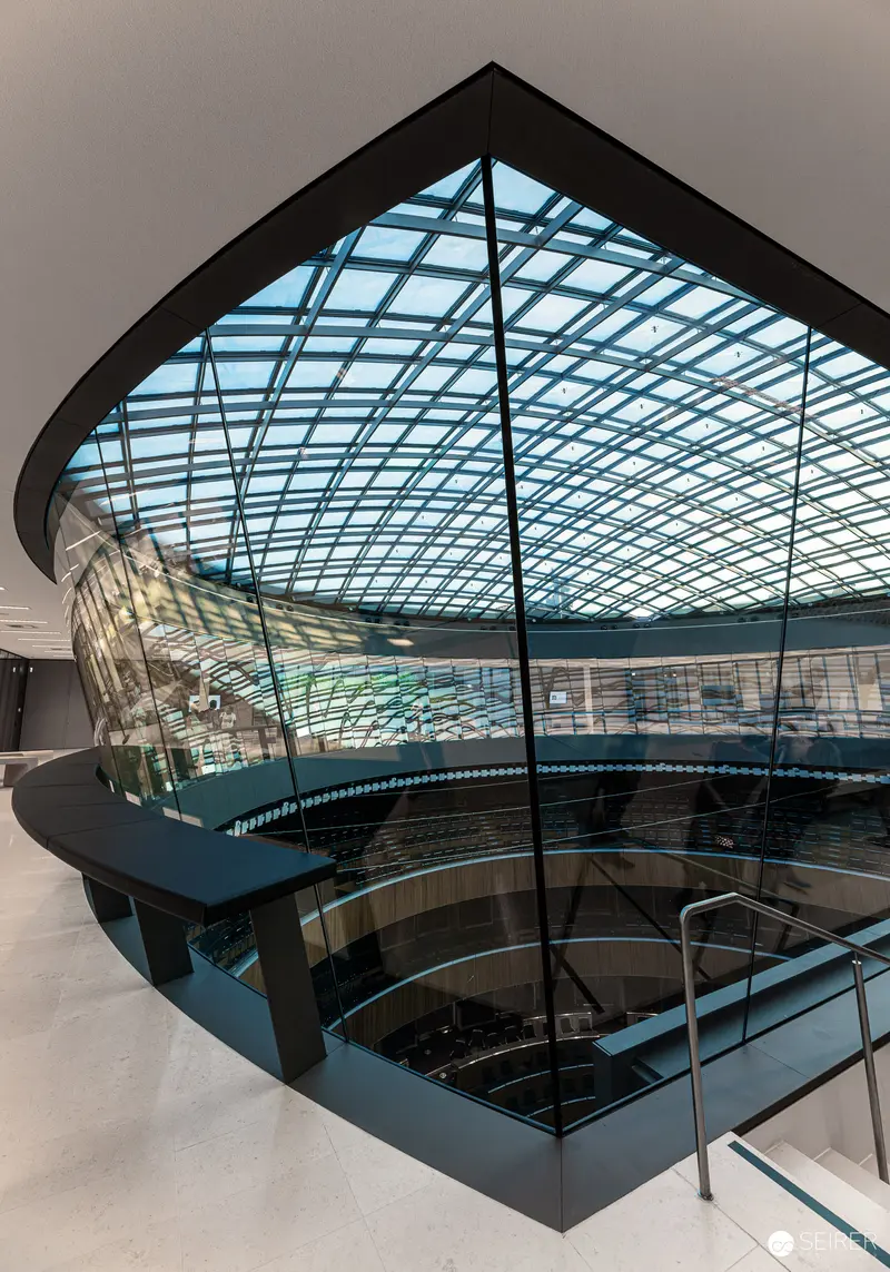 Modern Architectural Interior with Glass Atrium and Geometric Steel Framing