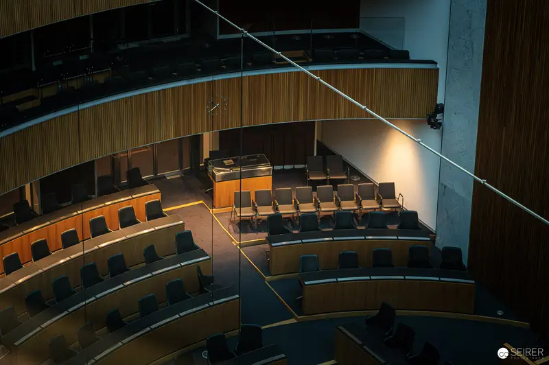 Interior View of Austrian Parliament's Renovated Lecture Hall with Dramatic Lighting