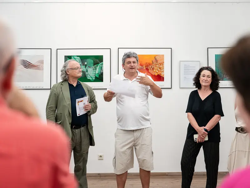 Art Gallery Opening with Three Curators Discussing Photographic Exhibition