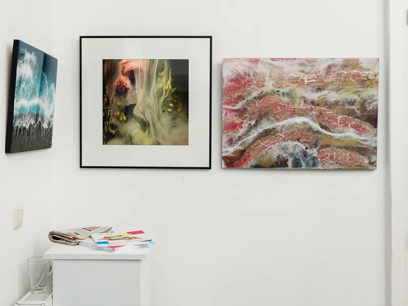 Contemporary Art Gallery Wall Display with Abstract Paintings and Minimalist Decor