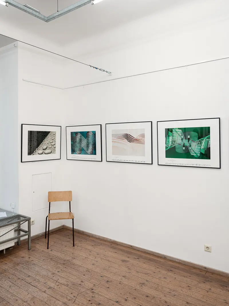 Gallery Interior with Framed Photographic Prints on White Wall