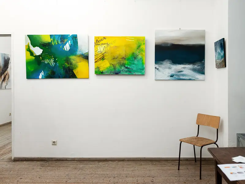 Gallery Interior with Abstract Paintings and Minimalist Chair