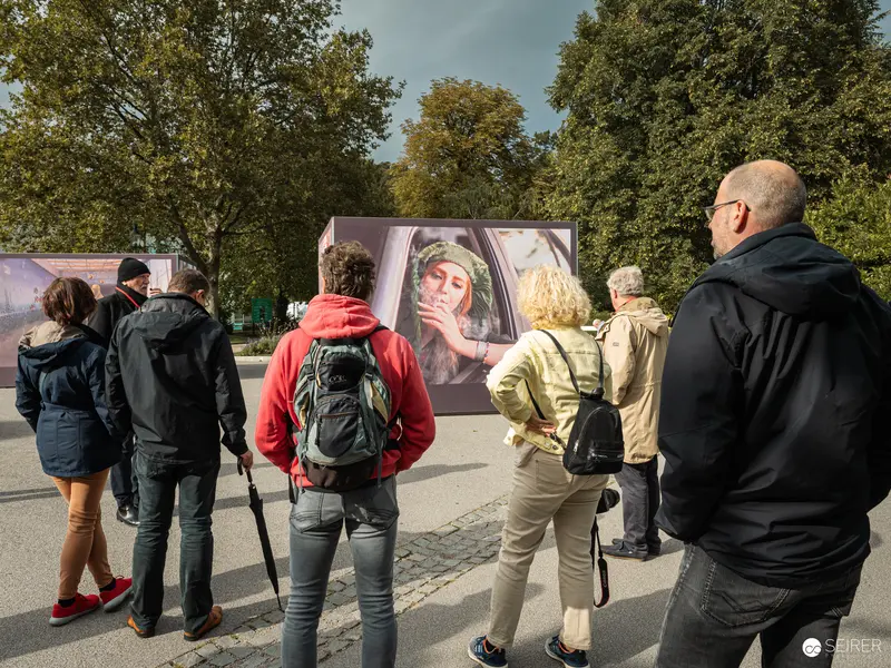 Visitors Viewing Photographic Exhibition at Ansichten Festival La Gacilly Baden, Austria