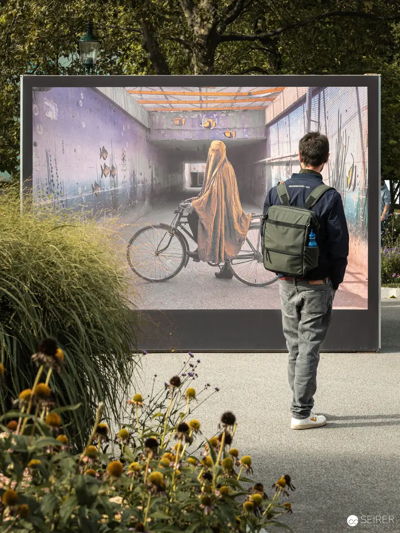 Ansichten Festival "Orient!": Cyclist in Ethereal Hallway Installation at La Gacilly Baden
