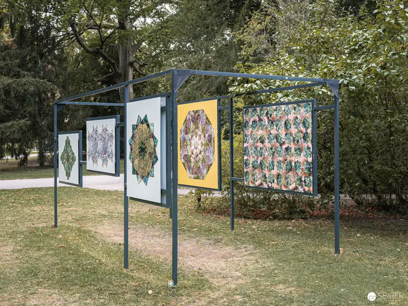 Outdoor Art Exhibition Panels Displaying Kaleidoscopic Patterns at La Gacilly Baden Festival