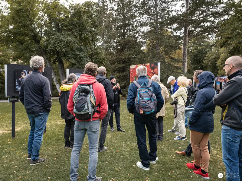La Gacilly Baden Outdoor Exhibition "Orient!" - Visitors Studying Photographic Displays