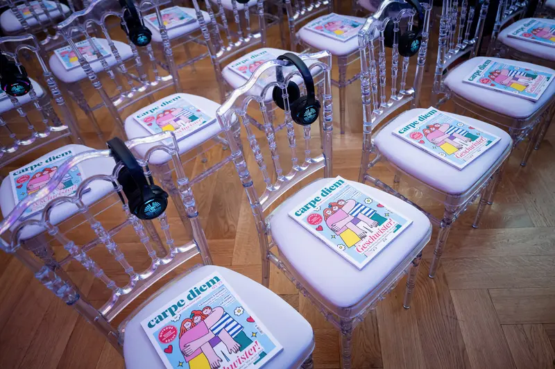 Transparent Chairs Display Colorful Listening Station at Health & Mind Festival