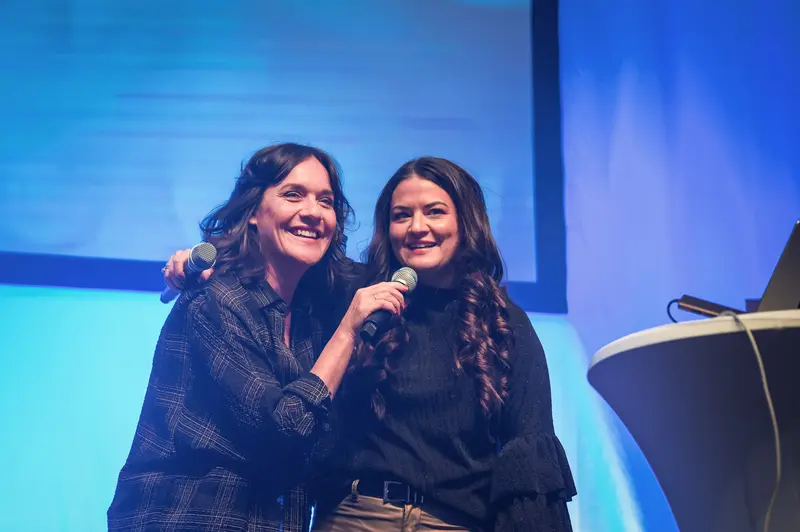 Health & Mind Festival: Two Speakers Share Joyful Moment on Stage