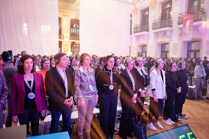 Health & Mind Festival: Audience Standing in Unified Concentration with Headphones