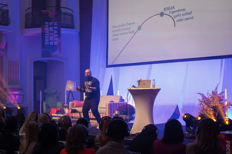 Health & Mind Festival Speaker Presenting Breakthrough Concept on Stage