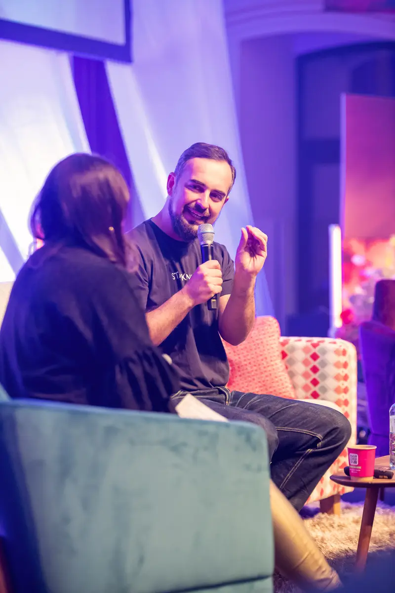Health & Mind Festival Speaker Engaging in Intimate Conversation on Stage