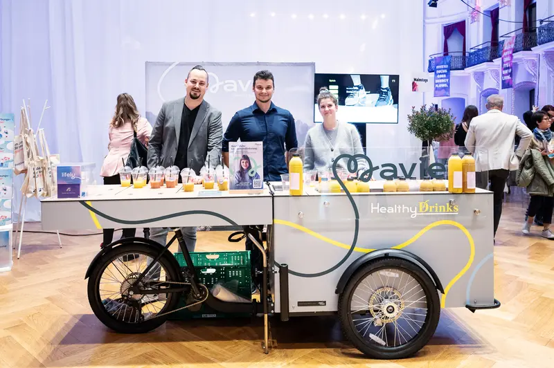 Health & Mind Festival Promotional Team Showcasing Healthy Drinks Mobile Cart