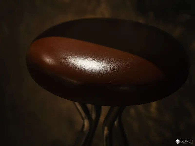 Intimate Brown Sculptural Form in Shadowy Illumination