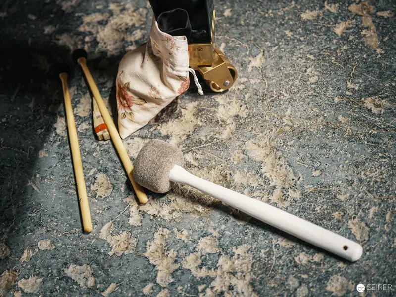 Archaeological Tools and Fabric on Textured Stone Surface