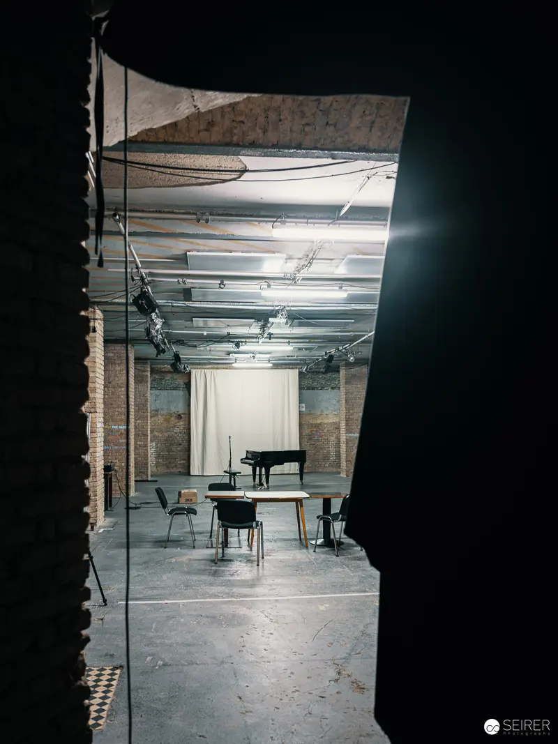 Sparse Interior with Grand Piano at Nestroyhof Hamakom Theater Rehearsal Space