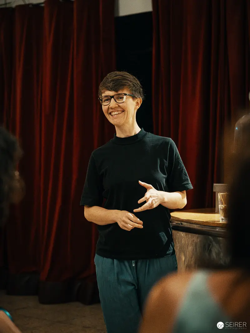 Bérénice Hebenstreit Directing Theatrical Rehearsal for "Der Nebel von Dybern"