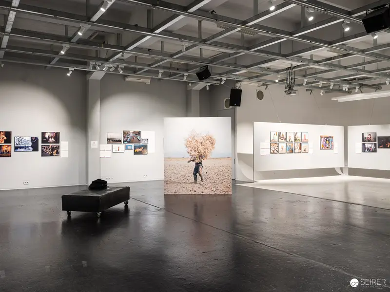 World Press Photo Exhibition 2023 at Westlicht Vienna: Dramatic Central Photographic Installation