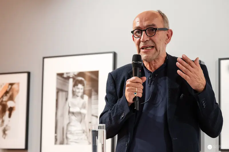 Scholarly Lecture on Photography with Expressive Speaker at Gallery Exhibition